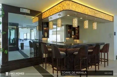 a bar in a restaurant with chairs and a mirror at Scenic place to stay in manila 3618 in Manila