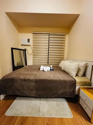 a bed with a stuffed animal on top of it at Relaxation Getaway in Manila