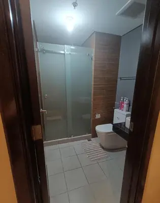 a bathroom with a shower and a toilet at Relaxation Getaway in Manila