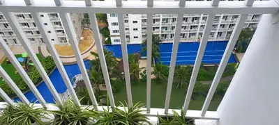 a view of the pool from the balcony of a apartment at Shore Tower B in Manila