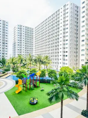 a playground in front of a large building at Manila Daze in Manila
