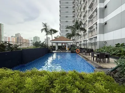 a swimming pool in the middle of a building at 2 Br Condo Apartment near PICC, CCP, WTC & Star City at Coast Residences, Pasay City in Manila