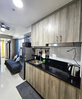 a kitchen with a sink and a stove at 2 Br Condo Apartment near PICC, CCP, WTC & Star City at Coast Residences, Pasay City in Manila