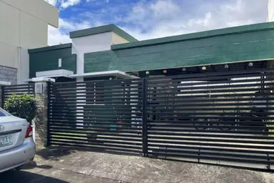 a black fence in front of a building at NRD Staycation Transient House in Dasmariñas