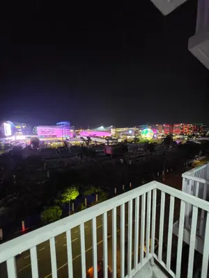 a view of a city at night with lights at MNM Place - Sea Residence 8D in Manila