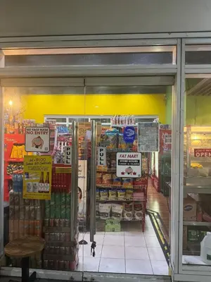 a store front of a grocery store with a window at 2BR Resort Type condo w city view Sheridan in Manila