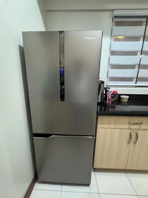 a stainless steel refrigerator in a kitchen at 2BR Resort Type condo w city view Sheridan in Manila