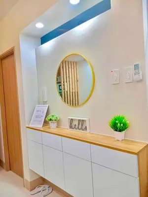 a bathroom with a mirror on the wall at Scandi-Style & Organic condo Shore 3 MOA in Manila