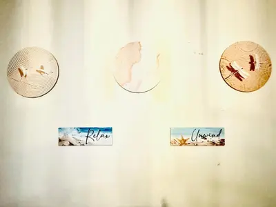 a white wall with clocks and signs on it at Beach Haven Condo in MOAs Shore Resort near Okada City of Dreams Solaire in Manila