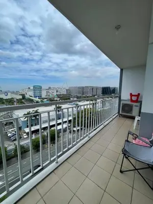 a balcony of a building with a view of a city at Shell Residence in Manila