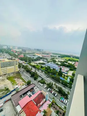 an overhead view of a city with a parking lot at JCS Place in Manila