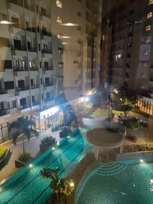an overhead view of a swimming pool in a building at Ohana Residences by SMDC in Manila