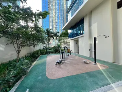 a group of benches in a courtyard in a building at Stylish BGC Condo by Grand Hyatt #upt16k in Manila