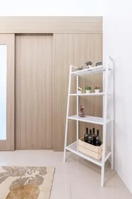 a white shelf with bottles on it in a room at BD281 House in Manila