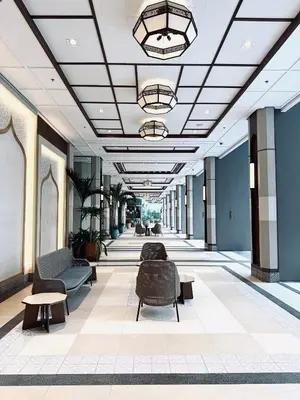a hallway with chairs and tables in a building at JFam Suites Allegra Condo with Balcony, FREE Parking in Manila