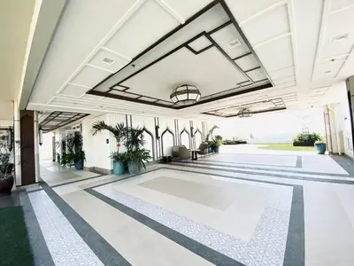 an empty lobby with a pool in a building at JFam Suites Allegra Condo with Balcony, FREE Parking in Manila