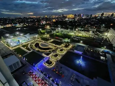 an aerial view of a city at night at 1 BR Nordic Suite with Netflix, Disney, Prime in Manila