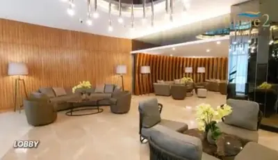 a living room with couches and a table and chairs at Franchelle Bliss - Shore 2 Residences Tower 1 in Manila