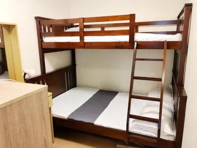 two bunk beds in a room with a counter at Velvet Accommodation PH in Manila