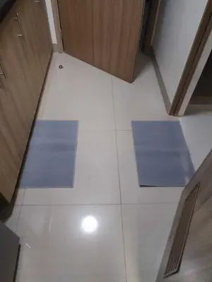 two blue mats on a white floor in a room at Qween E Choice 2 Qween bed Condo in Manila
