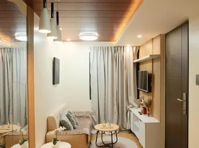 a living room with a couch and a table at Cozy Crib2 in Manila