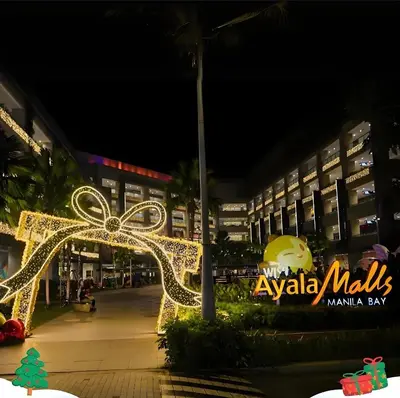 a christmas light display at a mall at night at Spacious Apartment Hotel near City of Dreams, Airport, MOA, Okada, Ayala Malls, and Solaire Casino with free 5 pool access in Manila