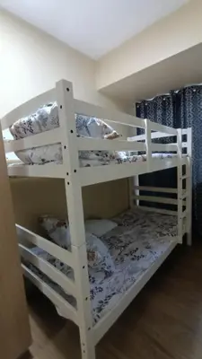 a white bunk bed with pillows on it at Joy Azure Escapes in Manila