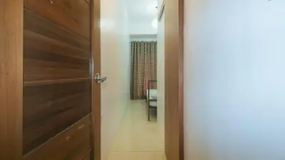 a door leading into a room with a hallway at Stay Manila Hotel by RedDoorz in Manila