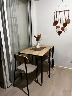 a dining room table and chairs in a room at Azure Condo Maui 1 bedroom in Manila