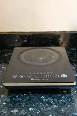 a remote control sitting on top of a counter at Forbeswood Heights BGC suite near st Lukes in Manila