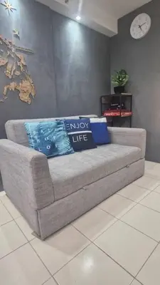 a couch with pillows on it in a room at 1BR with Prime Netflix, Disney HBO max in Manila