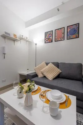 a living room with a couch and a table at SB1054 House in Manila