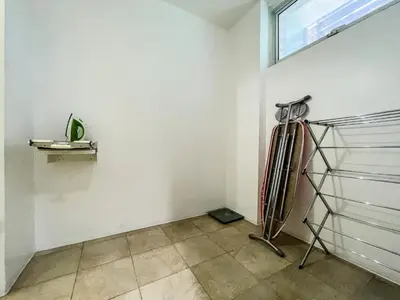 a room with a fan and a window at Full-Serviced Residential Apartment in Uptown, BGC in Manila