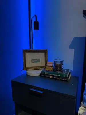 a table with a picture and books on it at Moody Space near NAIA TERMINALS in Manila