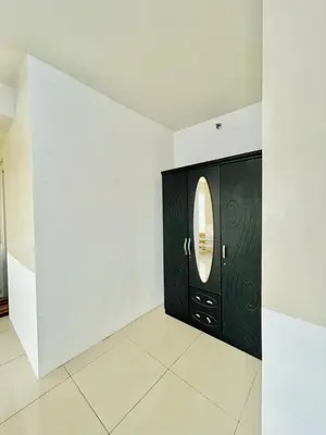 a black door with a round window in a room at SGG Manila 2Bedroom MOA View - Shell Residences MOA Near Airport in Manila