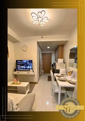a living room with a kitchen and a dining room at Celebrity Haven in Manila