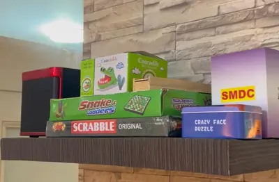a shelf with boxes of snacks on it at RE Staycations in Manila