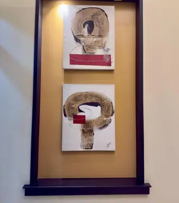 a framed picture of a toilet on a wall at Joyce Apartelle Mandaluyong in Manila
