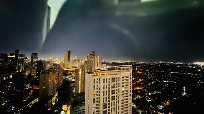 a view of a city skyline at night at The Beacon Skyview 2BR La Suitez4307 in Manila