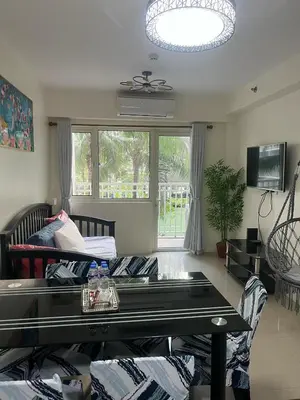 a living room with a couch and a table at 2Br Suite Shore Residences by JMS in Manila
