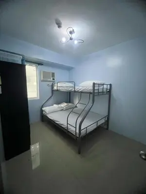 a bedroom with a bunk bed in a room at 2Br Suite Shore Residences by JMS in Manila
