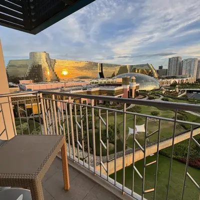 a balcony with a view of a city at Panoramic Landscape and Seaview, 2BR, Near Airport, 8m in Manila