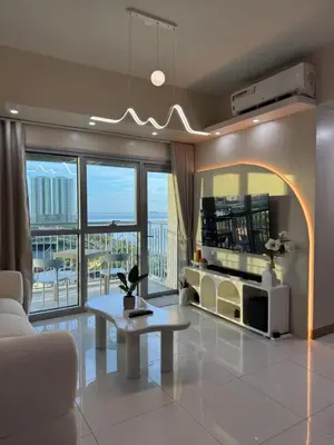a living room with a couch and a table at Panoramic Landscape and Seaview, 2BR, Near Airport, 8m in Manila