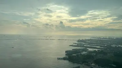 an aerial view of the ocean with boats in the water at 3BR Grand Riviera Suites by MrSayla in Manila