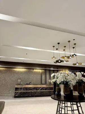 a lobby with a table with flowers on it at Clarquin Residences - Shore 3 Residences Tower 2 in Manila