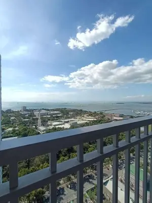 a view of a city from the balcony of a building at Breeze Residences in Manila