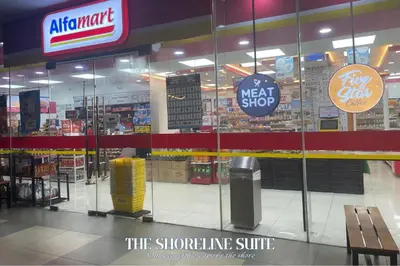 a store with glass doors in a shopping mall at The Shoreline Suite at Shore 3 Residences MOA Pasay in Manila