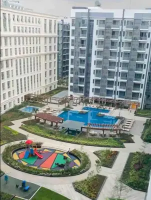 an aerial view of a playground in front of tall buildings at C12F JRM Staycation Naia T3 Near Airport With Parking in Manila