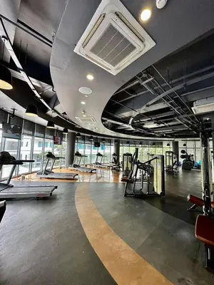 a gym with a bunch of treadmills and machines at Jing'sCrib 2BR Apartment by Azure Near Manila International Airport in Manila