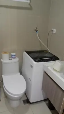 a bathroom with a toilet and a sink at Shore 3 Tower 2 near MOA Parking WI-FI Netflix in Manila